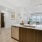 a kitchen with wood cabinets