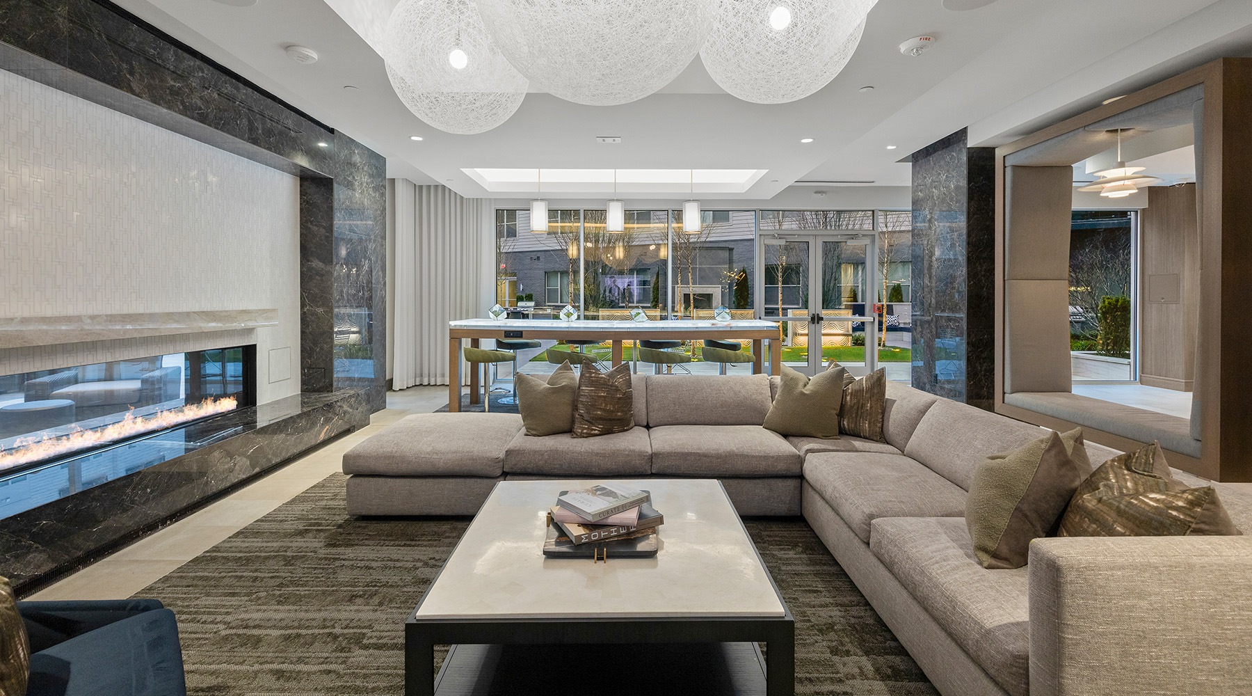 a living room with a large couch and fireplace