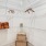 a closet with a shelves and baskets